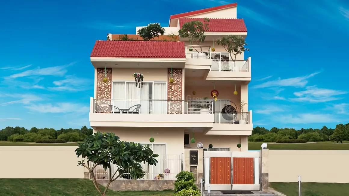 Gaurs 2nd Park View — A modern residential villa with red tiled roofs, multiple balconies with glass railings, and a brown patterned gate, under a clear blue sky.