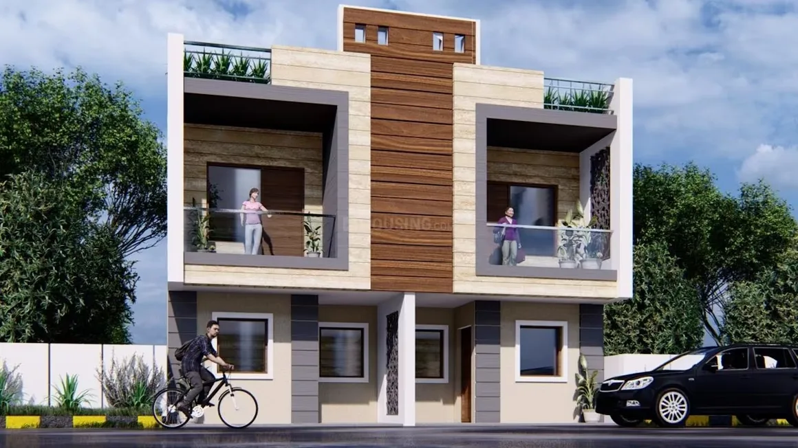 THV Vihaan Villa — A modern rendered duplex villa with two units, each having a balcony with glass railings. A person on a bicycle on the left, a car on the right.