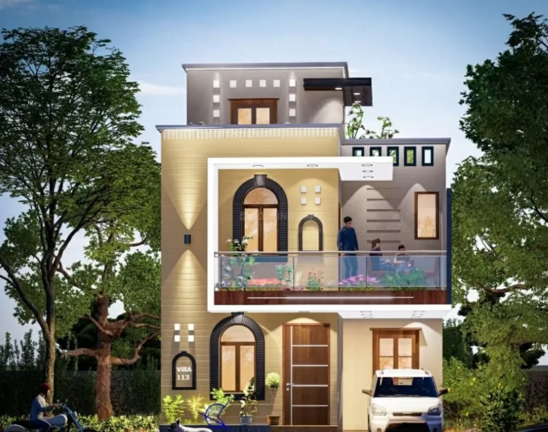 Radhika Green — A modern rendered villa with a light yellow facade, a small balcony with people, and a white car parked in front.