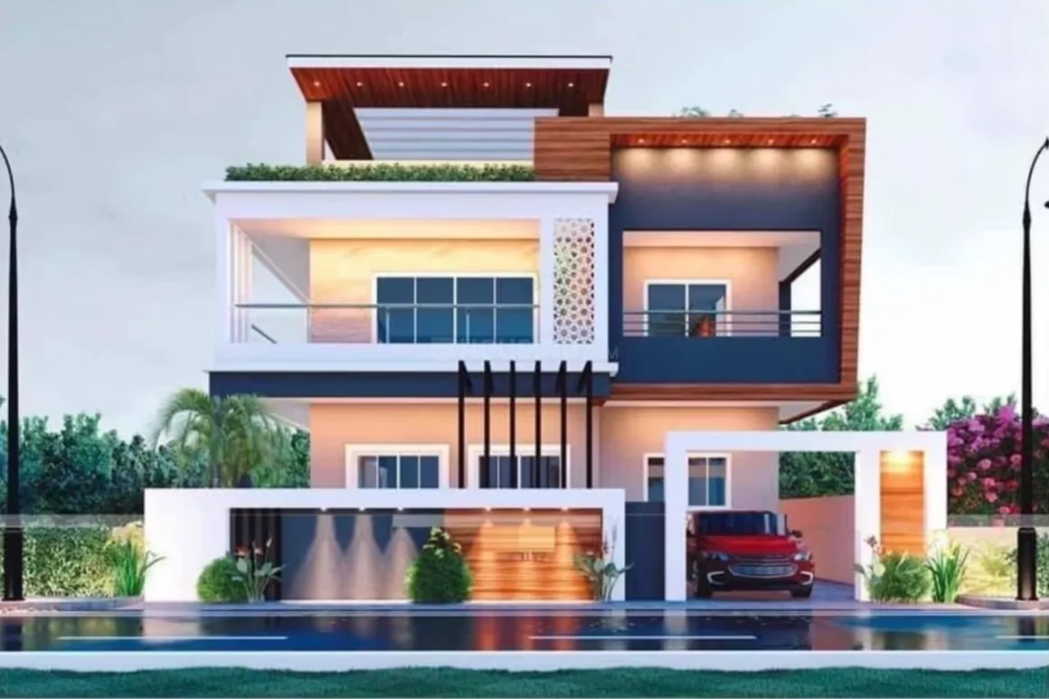 Gokul Dham — A modern rendered image of a three-story villa with a red car parked in the driveway. The house has white and dark grey accents with wooden elements and balconies. There is landscaping ar
