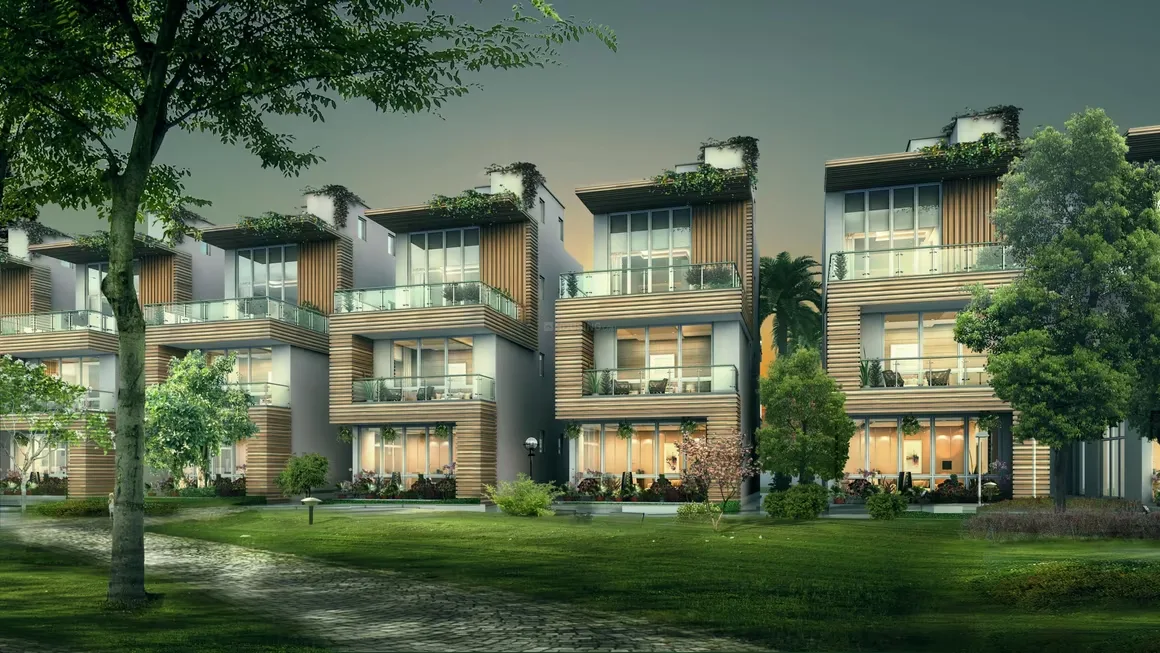 Sunrise Suntwilight Recreational Phase 1 — A row of modern villas with wooden facades, balconies, and green roofs, surrounded by lush green lawns and trees.