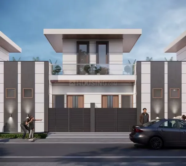 Ved Homes — A modern rendered villa with a light grey and white facade, featuring a balcony with glass railing, and a dark grey gate.